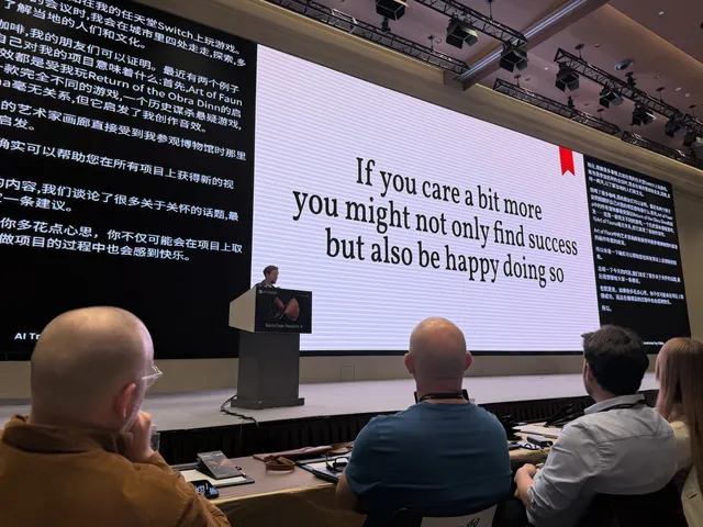 Klemens Strasser showing a slide that says if you care a bit more, you might not only find success but also be happy doing so